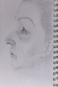 graphite sketch on paper self portrait profile facing left and looking upwards